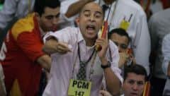 A stock trader gives instructions from the exchange floor. Picture: Getty