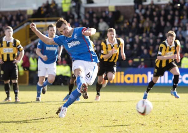 Lee McCulloch tucks away an injury time penalty to give Rangers a barely-deserved three points. Picture: SNS