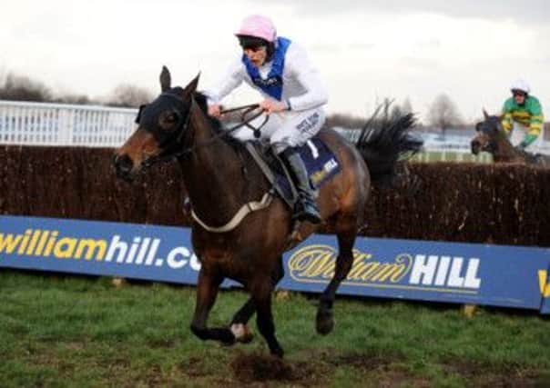 Night In Milan ridden by James Reveley jumps the last fence to win The William Hill Grimthorpe Chase Handicap Steeple Chase. Picture: PA