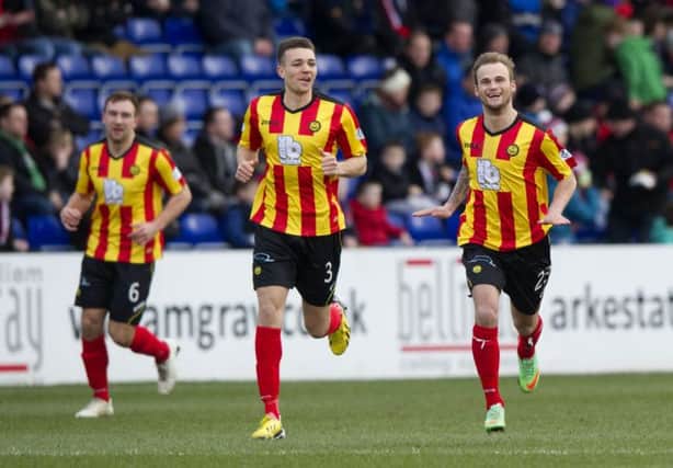 Kallum Higginbotham (right) celebrates his opening goal for Partick Thistle. Picture: SNS