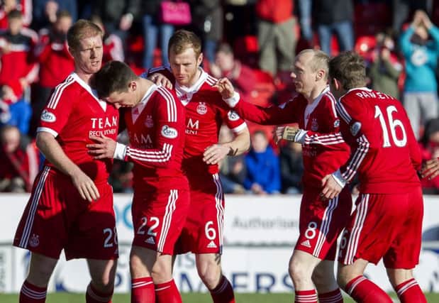 Ryan Jack is congratulated by his team-mates after scoring what turned out to be the winner. Picture: SNS
