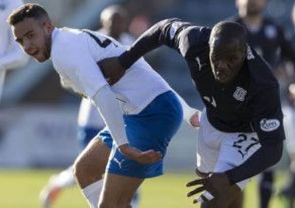 Dundee's Christian Nade (right) battles with Darren Cole of Morton. Picture: SNS