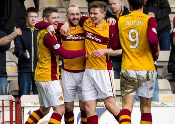 James McFadden celebrates with team-mates. Picture: SNS