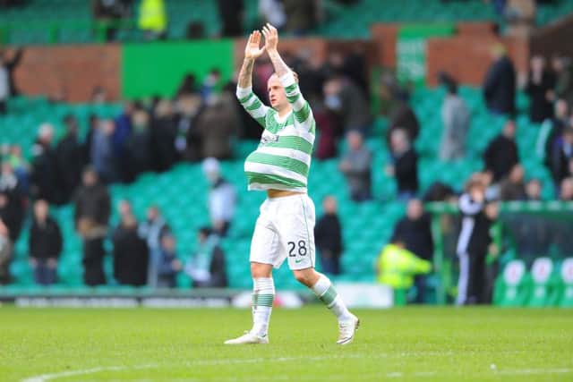 Leigh Griffiths with his hat-trick ball. Picture: Robert Perry