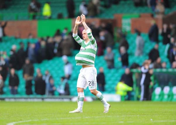 Leigh Griffiths with his hat-trick ball. Picture: Robert Perry