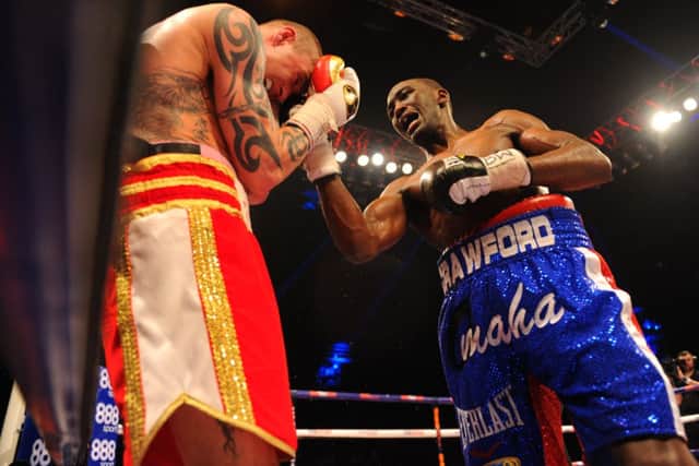 Crawford lays into Ricky Burns during their fight at the Hydro on Saturday night. Picture: Robert Perry