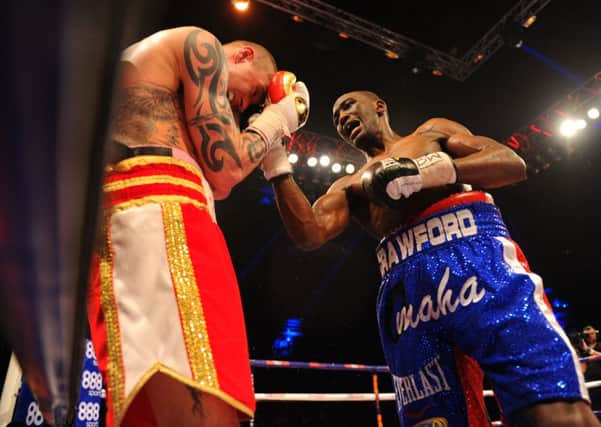Crawford lays into Ricky Burns during their fight at the Hydro on Saturday night. Picture: Robert Perry