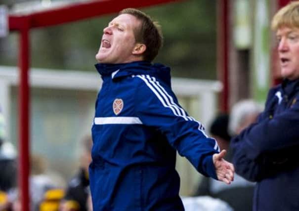 Hearts manager Gary Locke attempts to rally his team from the sidelines. Picture: SNS