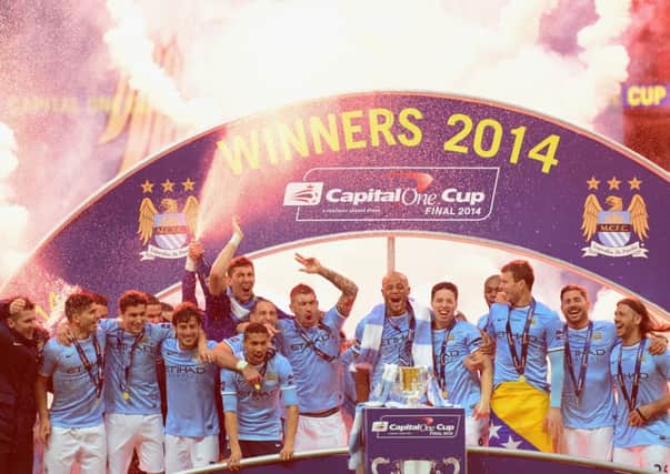 Manchester City players celebrate victory in the Capital One Cup Final. Picture: Getty
