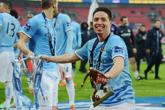Samir Nasri celebrates with the Capital One Cup. Picture: Getty
