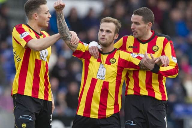 Kallum Higginbotham celebrates his opening goal. Picture: SNS