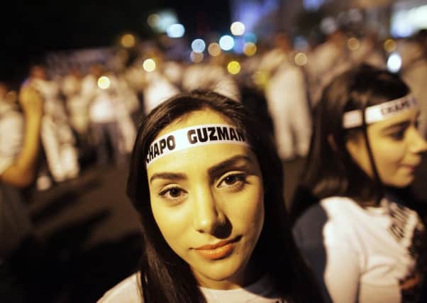 Young women show their allegiance to Guzman. Pictures: Reuters