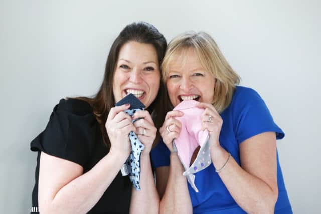 Amy Livingstone and Julie Wilson with their neckerchews. Picture: Contributed