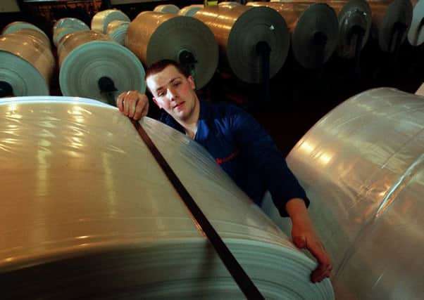 A British Polythene Industries worker at the firm's Greenock factory. Picture: Stephen Mansfield