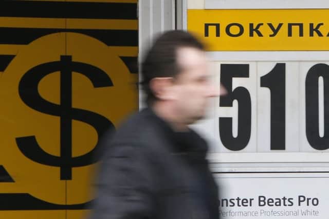 A man passes by a currency exchange office in Moscow. Picture: Maxim Shemetov/Reuters