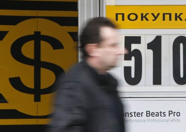 A man passes by a currency exchange office in Moscow. Picture: Maxim Shemetov/Reuters