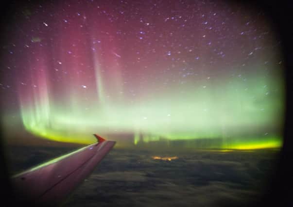 A photograph of the Northern Lights off Shetland taken by a passenger on a BA flight. Picture: PA