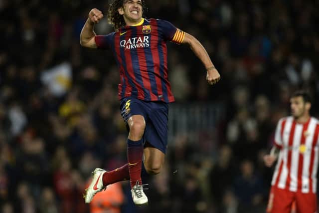 Carles Puyol celebrates after netting for Barcelona against Almeria. Picture: AFP