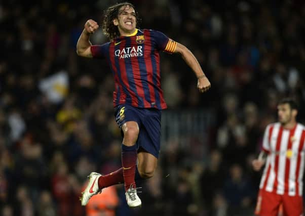 Carles Puyol celebrates after netting for Barcelona against Almeria. Picture: AFP