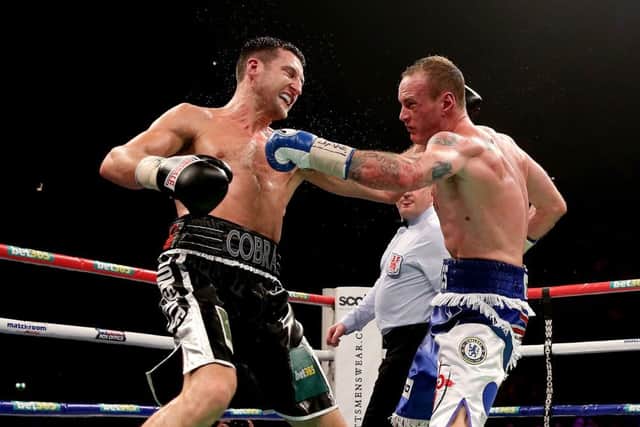 Carl Froch, left, in action with George Groves during their IBF and WBA World Super Middleweight bout last November. Picture: Getty