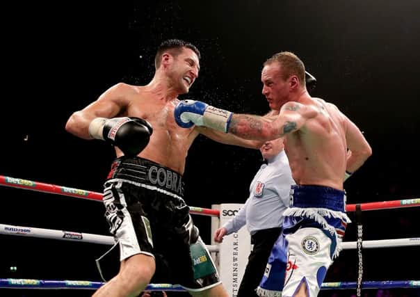 Carl Froch, left, in action with George Groves during their IBF and WBA World Super Middleweight bout last November. Picture: Getty
