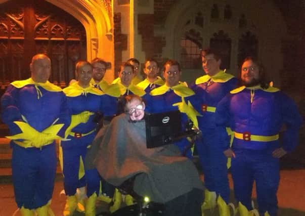 Stephen Hawking poses with a group of men on a stag night out in Cambridge. Picture: SWNS