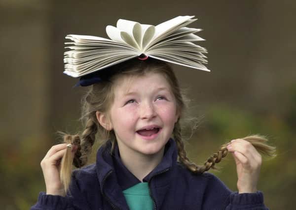As book shops and sales struggle, getting youngsters into the habit of reading is crucial. Picture: Julie Bull