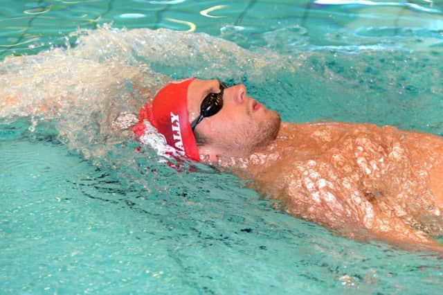 Craig McNally trains at the Commonwealth Pool in Edinburgh and hopes to be both smiling and wearing a gold medal around his neck later in the year. Pictures: Jon Savage