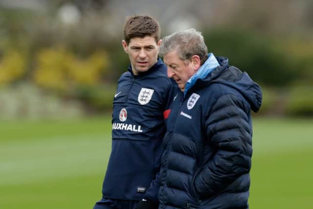 England captain Steven Gerrard, left, chats with manager Roy Hodgson. Picture: AP