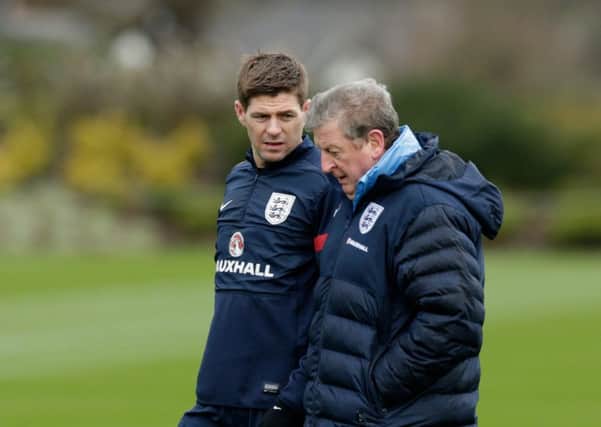 England captain Steven Gerrard, left, chats with manager Roy Hodgson. Picture: AP