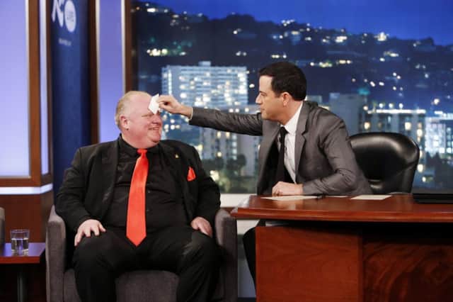 Toronto mayor Rob Ford, left, having his forehead wiped by host Jimmy Kimmel on the US host's chat show. Picture: AP
