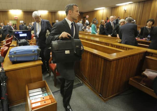 Oscar Pistorius leaves court on the second day of his murder trial. Picture: Getty
