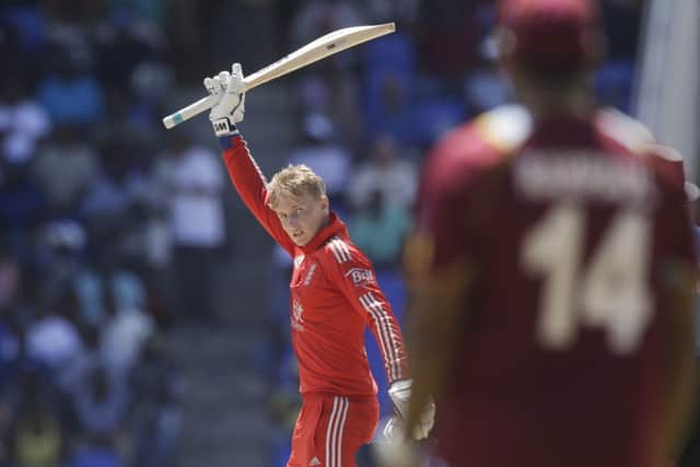 Joe Root raises his bat after completing his maiden one-day international century.  Picture: Reuters