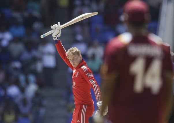 Joe Root raises his bat after completing his maiden one-day international century.  Picture: Reuters