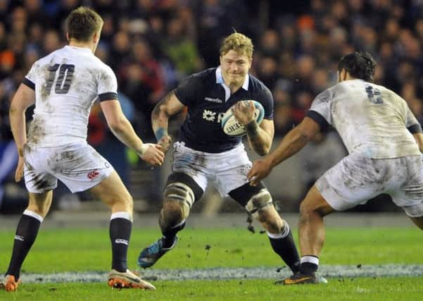Scotland's David Denton takes on the English defence during the infamous 20-0 defeat at Murrayfield. Picture: Jane Barlow