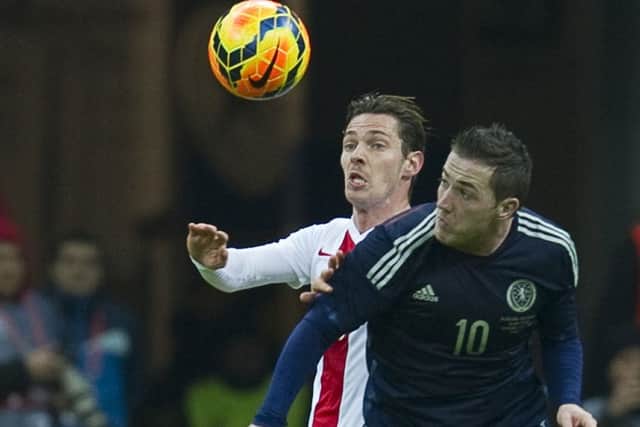 Scotland's Ross McCormack (R) takes on Ludovic Obraniak. Picture: Getty