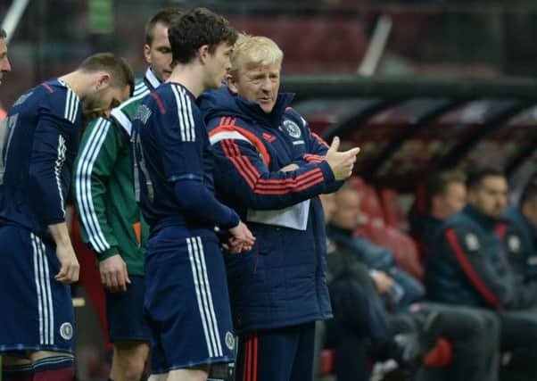 Some last minute advice for Scotland debutant Andrew Robertson (left) from manager Gordon Strachan. Picture: SNS