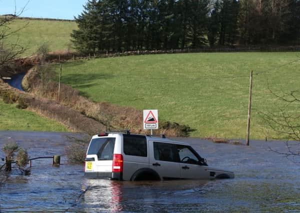 A man was rescued from this 4x4 in Longcroft, Falkirk. Picture: PA