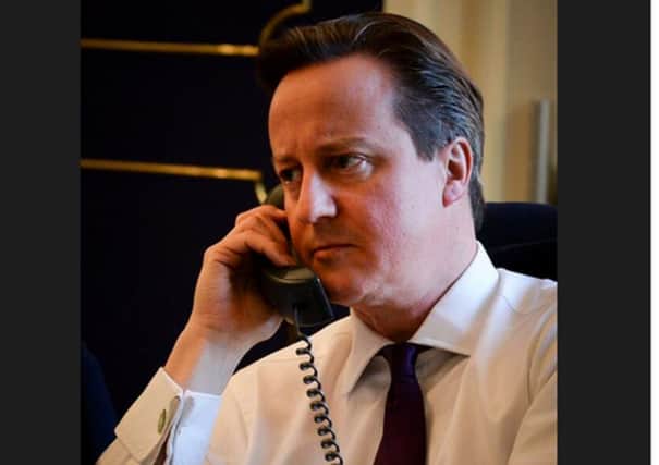 David Cameron on the phone to Barrack Obama. Picture: Twitter