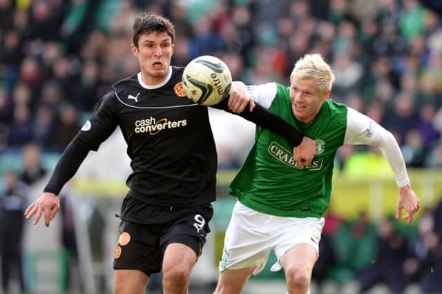 Ryan McGivern battles with John Sutton of Motherwell. Picture: SNS