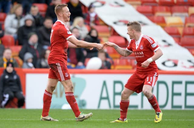 Jonny Hayes congratulates Adam Rooney on his goal. Picture: SNS