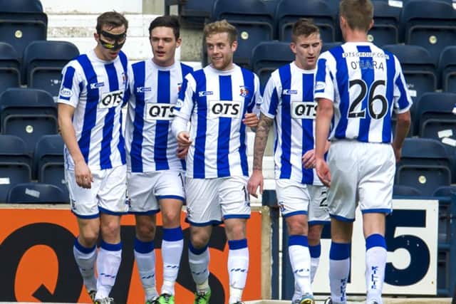 Kilmarnock players celebrate after Danny Wilson's own goal gave the Rugby Park side the lead. Picture: SNS