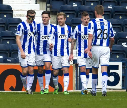 Kilmarnock players celebrate after Danny Wilson's own goal gave the Rugby Park side the lead. Picture: SNS