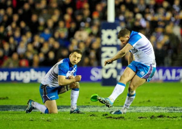 Greig Laidlaw assists Duncan Weir with a kick for goal. Picture: Ian Rutherford