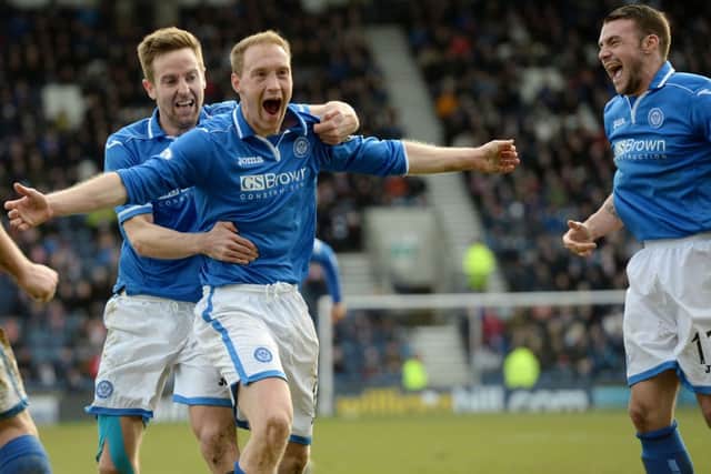 Steven Anderson is mobbed by his team mates after adding St Johnstone's third. Picture: SNS