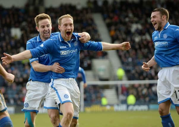 Steven Anderson  is mobbed by his team mates after adding St Johnstone's third. Picture: SNS