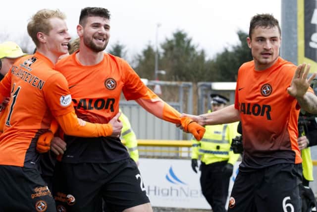 Nadir Ciftci celebrates his second goal with Gary Mackay-Steven (left) and Paul Paton (right). Picture: SNS