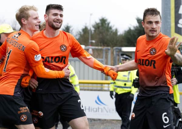 Nadir Ciftci celebrates his second goal with Gary Mackay-Steven (left) and Paul Paton (right). Picture: SNS
