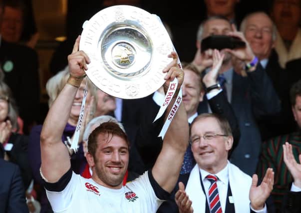 Captain Chris Robshaw lifts the Triple Crown trophy after victory over Wales. Picture: David Rogers/Getty Images
