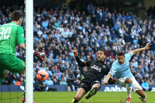 James Perch beats Gael Clichy to score Wigan's second goal. Picture: Jan Kruger/Getty Images
